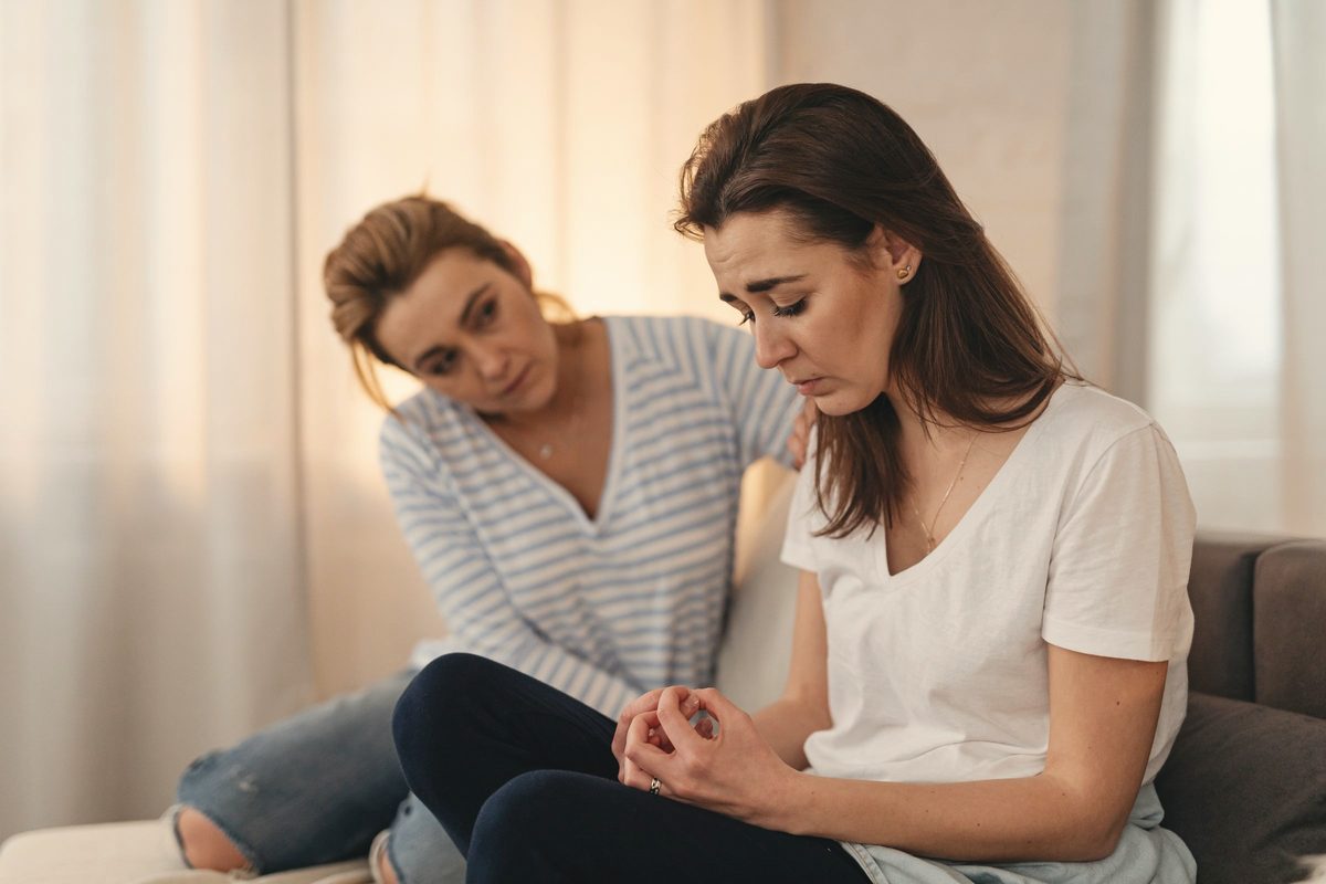 Woman comforting her friend