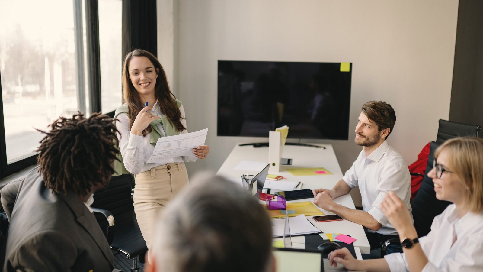 Colleagues discussing ideas in the office