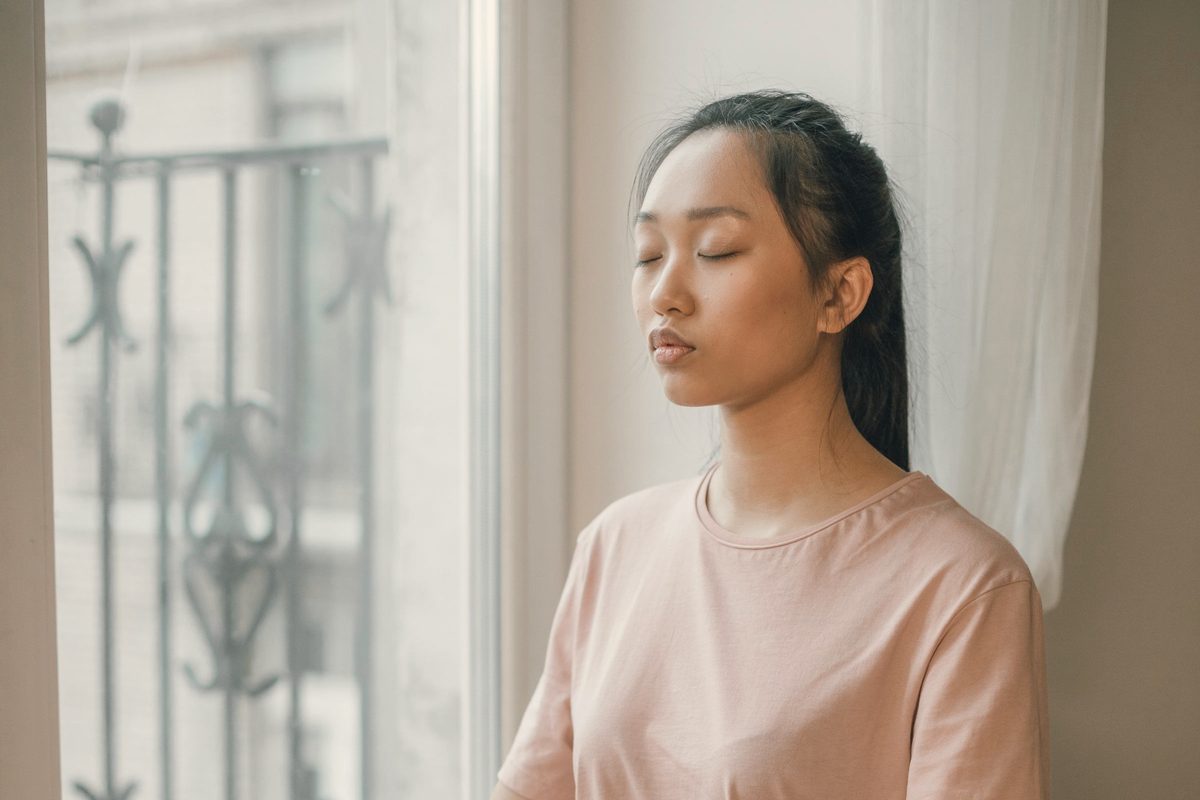 Woman meditating with her eyes closed