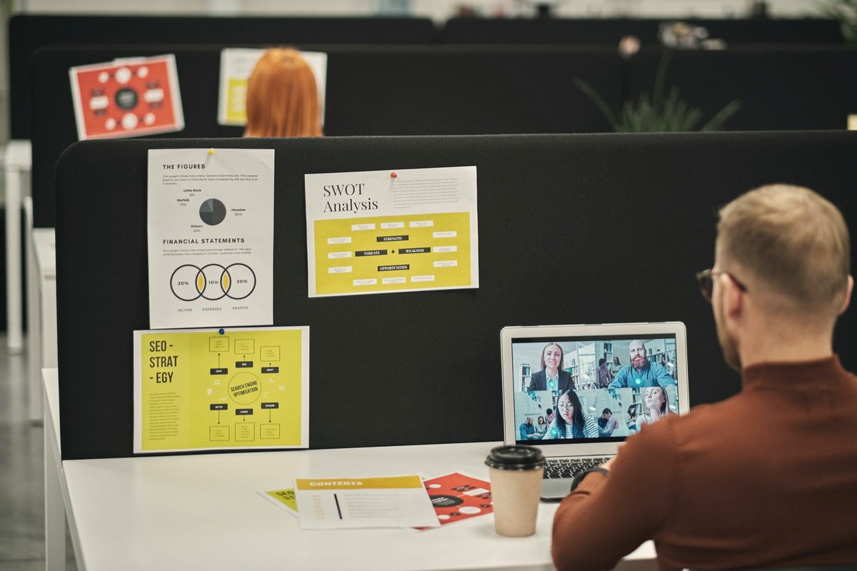 Man planning his tasks with notes on the wall