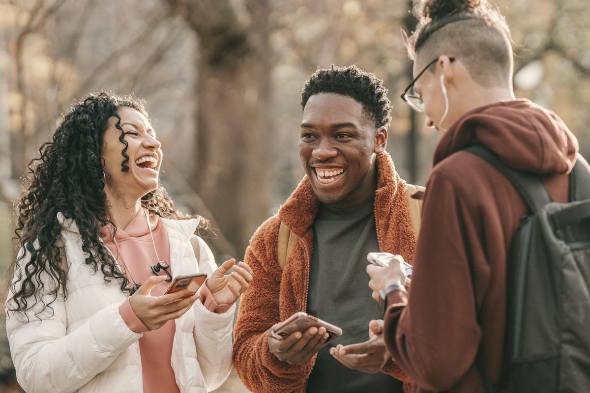 Friends laughing together outdoors