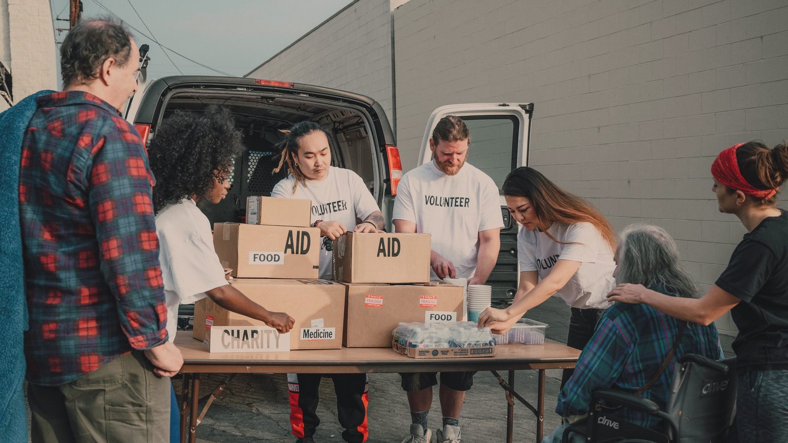 Volunteers handing out supplies to the community