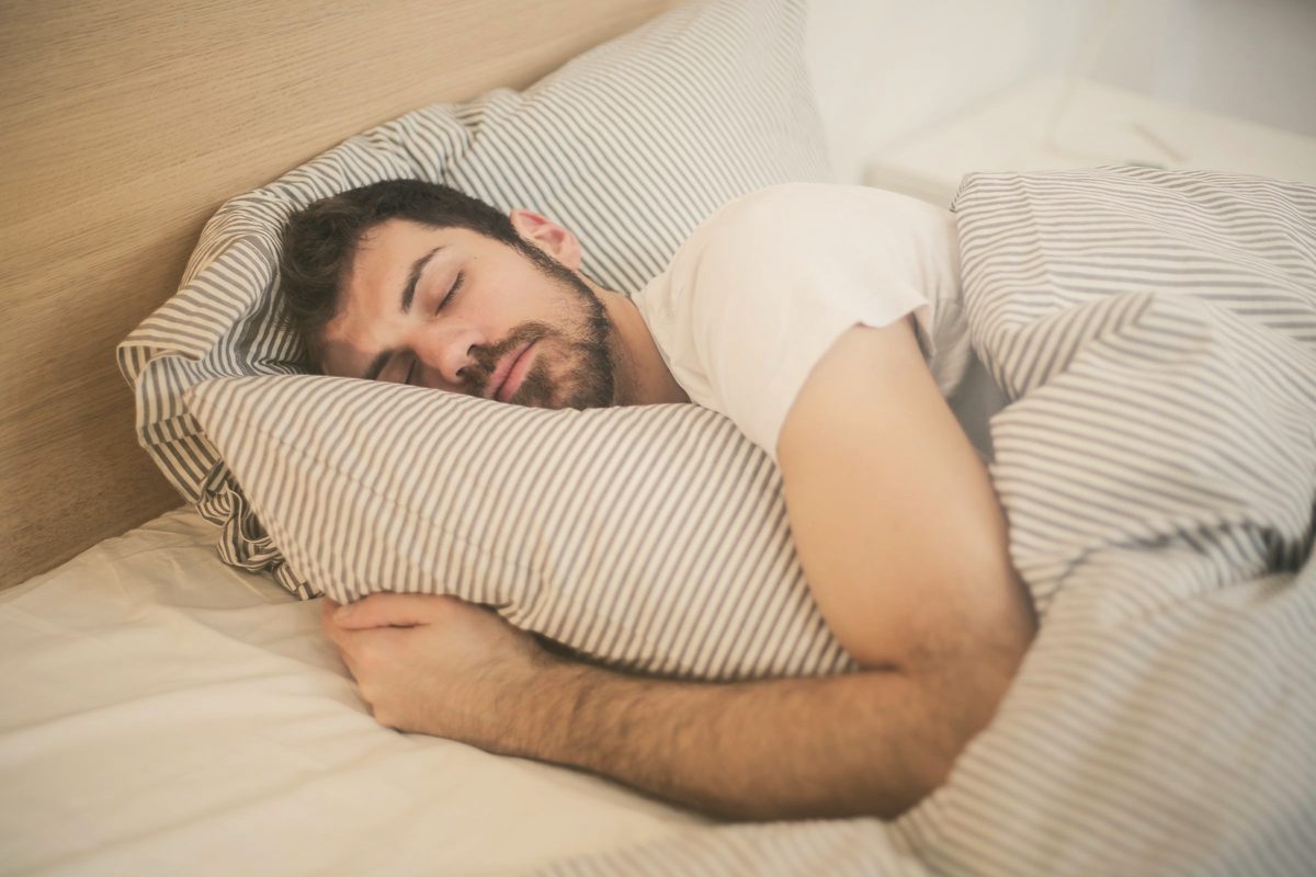 Man sleeping soundly on a soft pillow