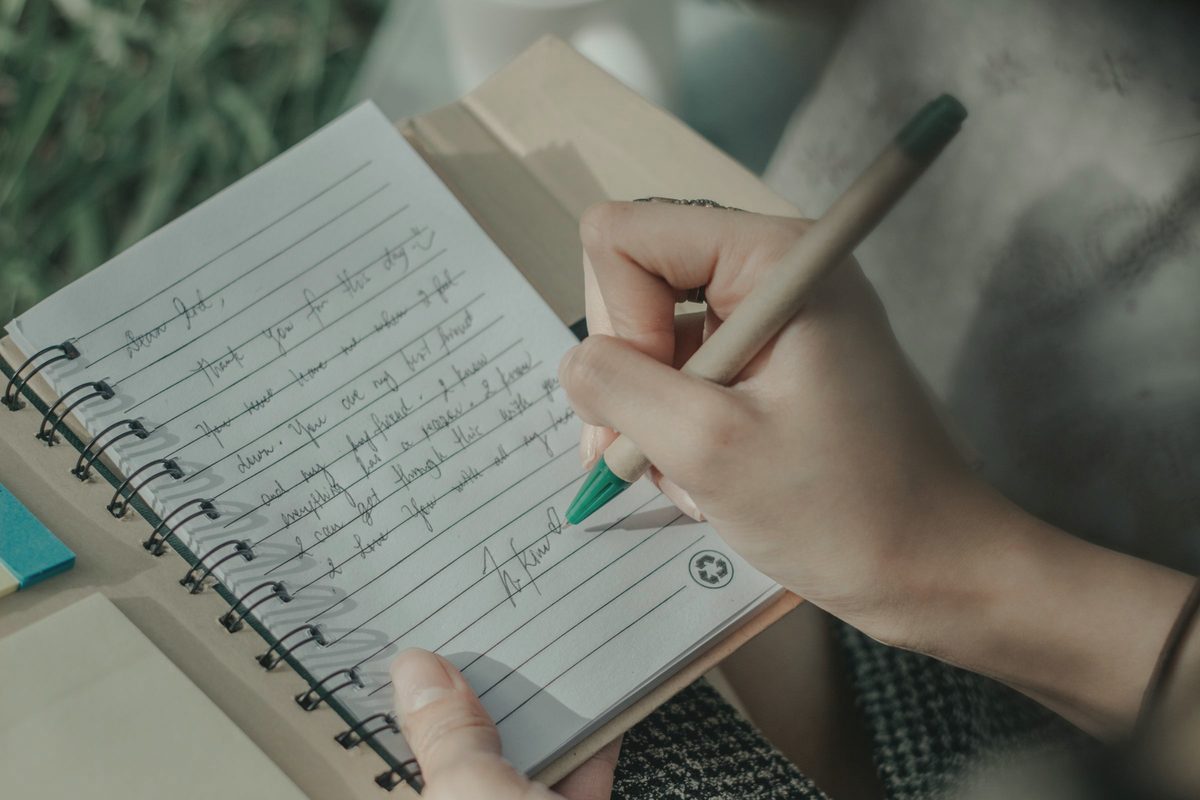 Writing a note in a journal