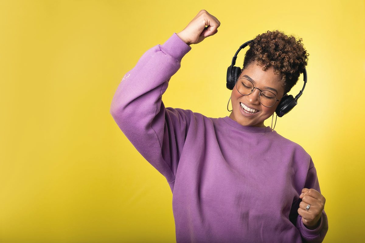 Woman dancing while listening to music