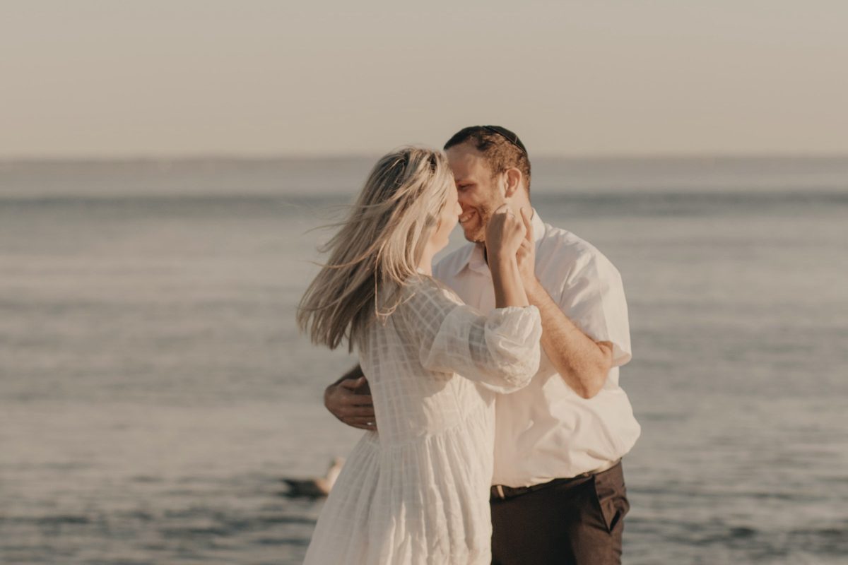 Couple dancing together on the beach