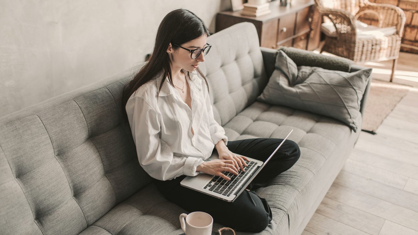 Woman working at home using laptop