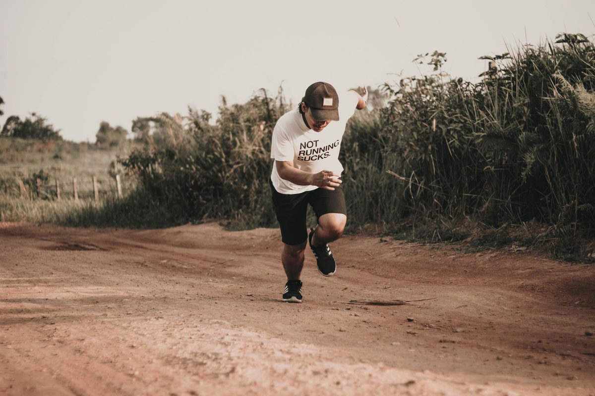 Man running along a dirt road