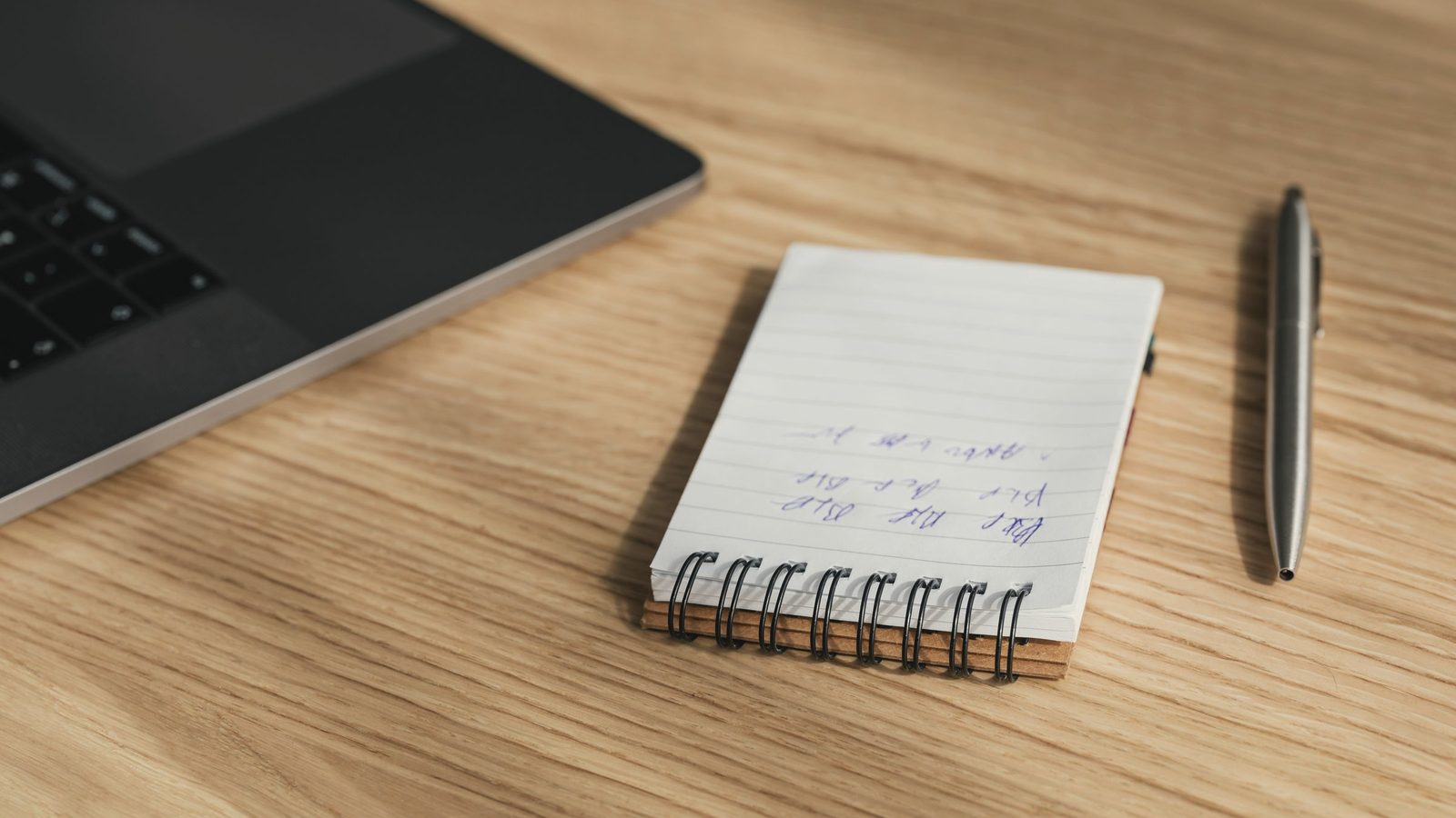 Open notebook and pen on a table