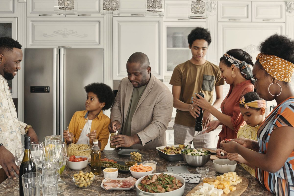 Family preparing food in the kitchen