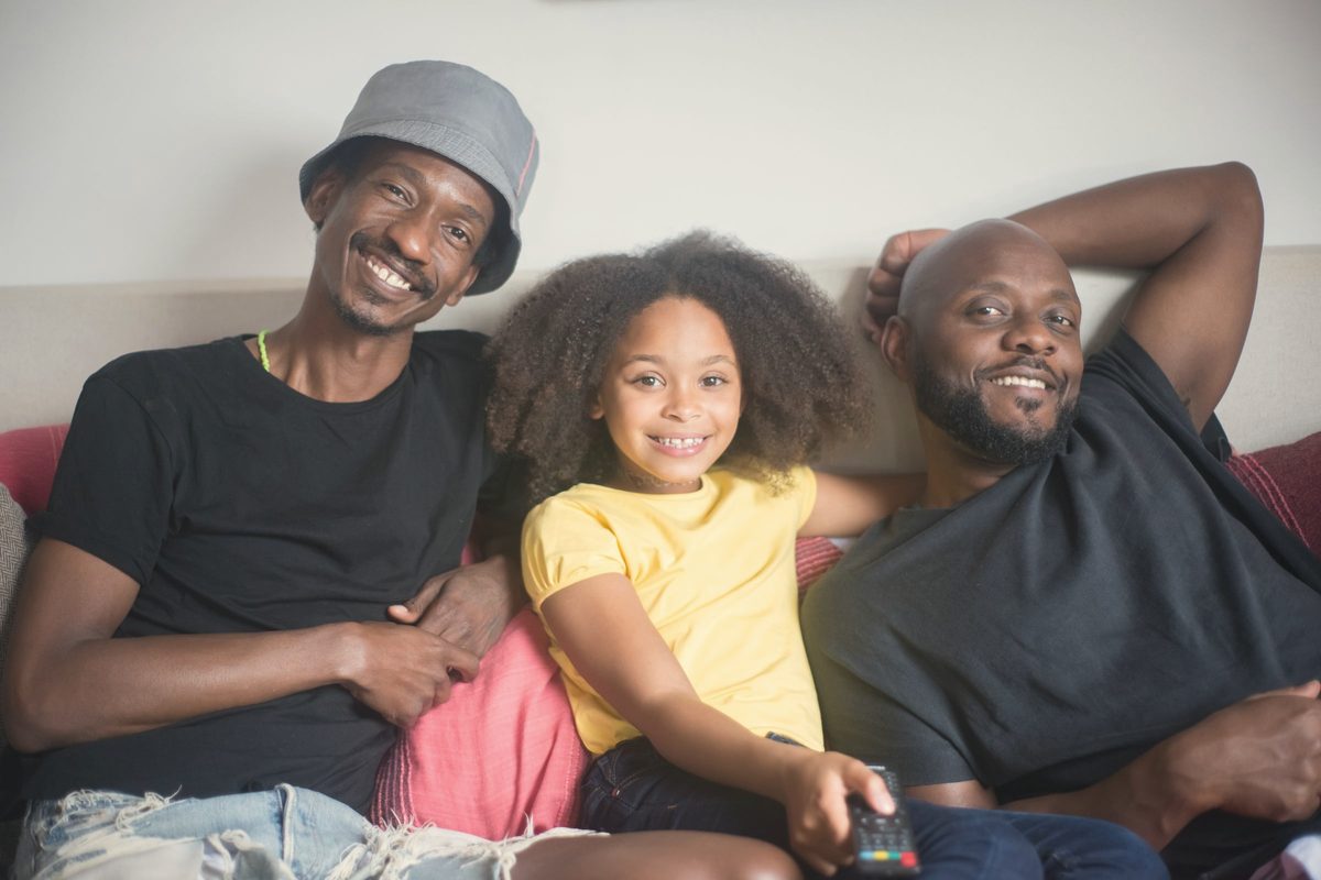 Family smiling together on the sofa