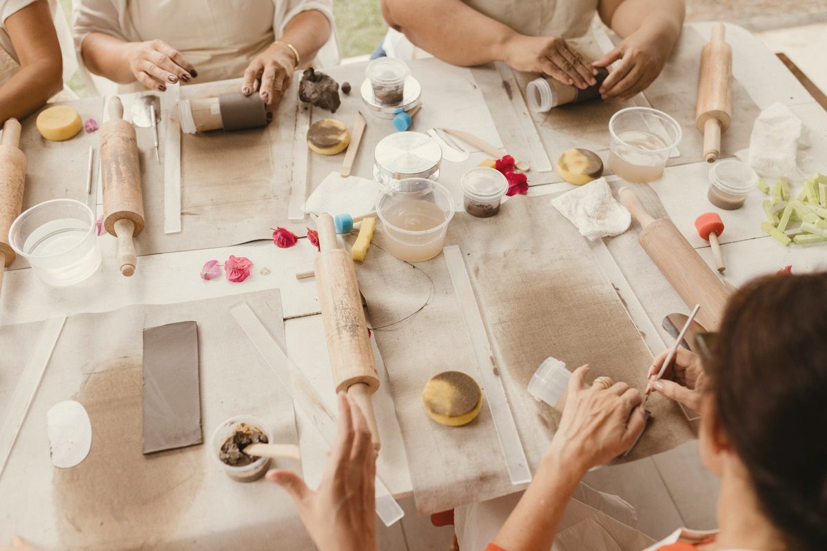 A group of people making crafts at a table