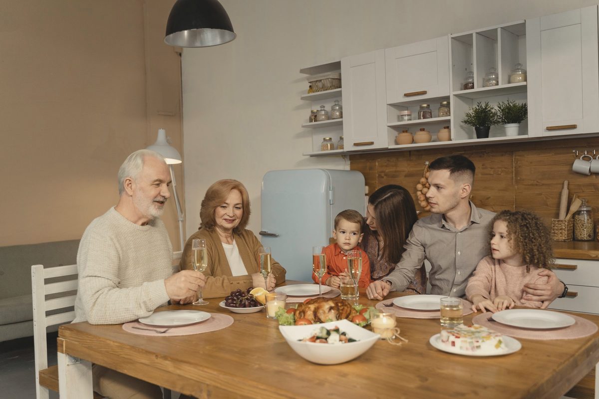 Family sharing a meal at the kitchen table
