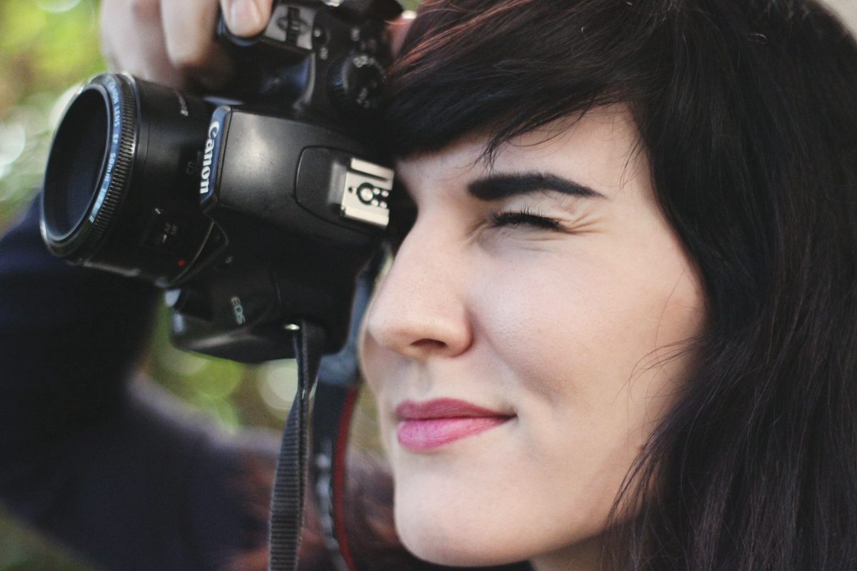 Woman taking a photo with a camera