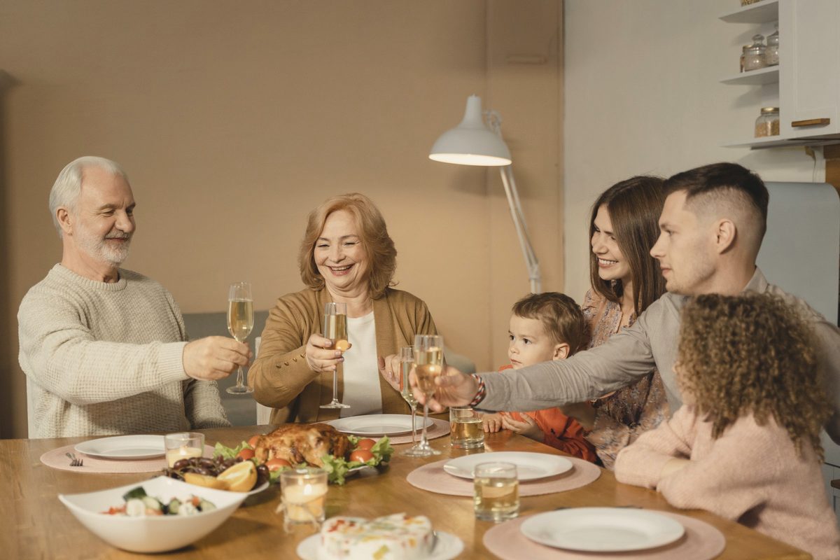 A family sitting on dining table