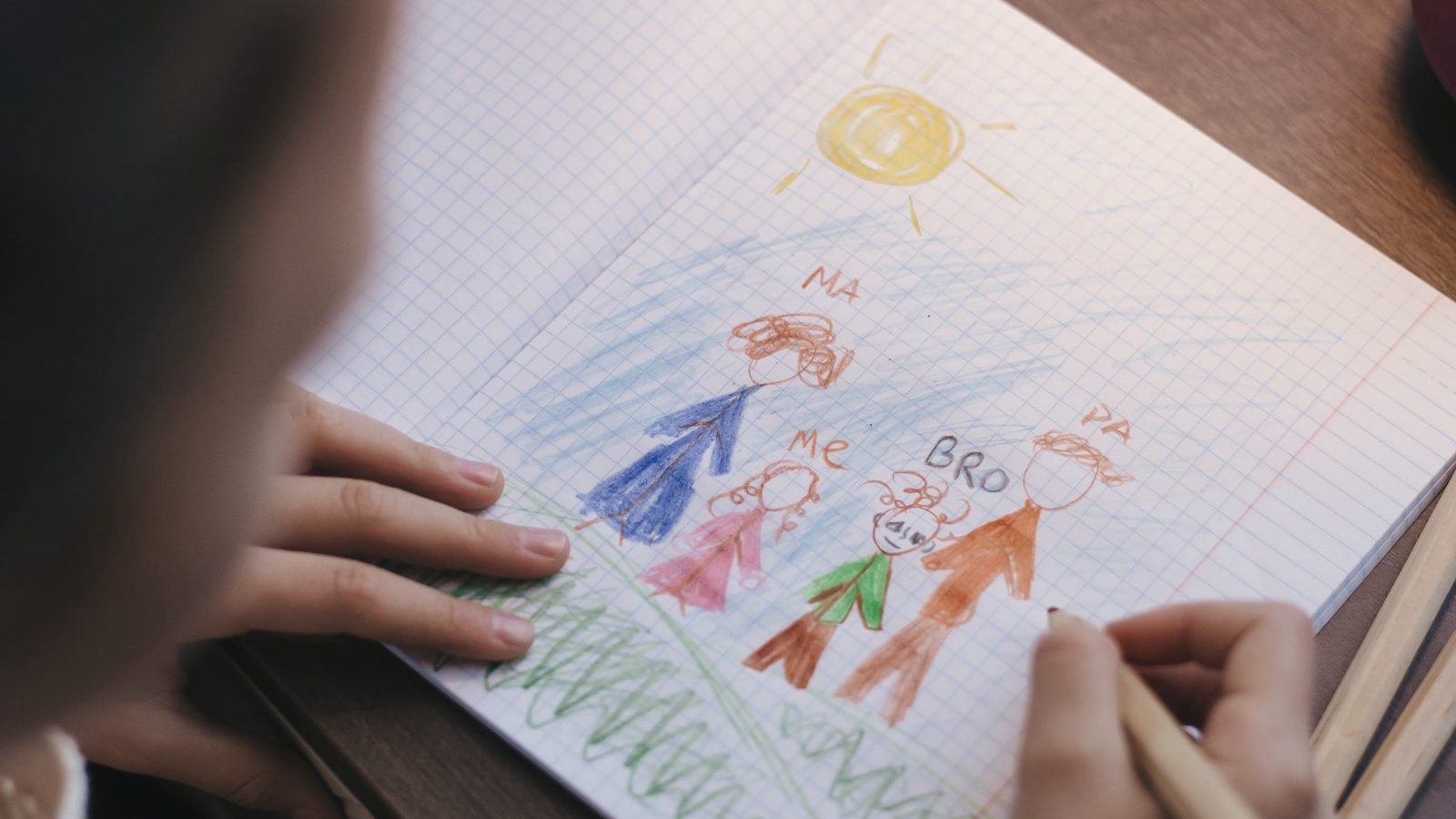 Child drawing family
