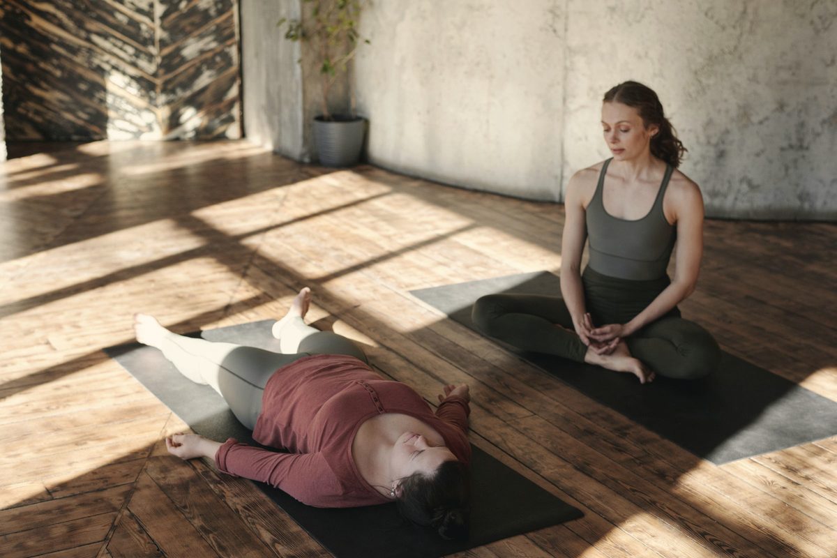 Woman meditating in a sunlit room
