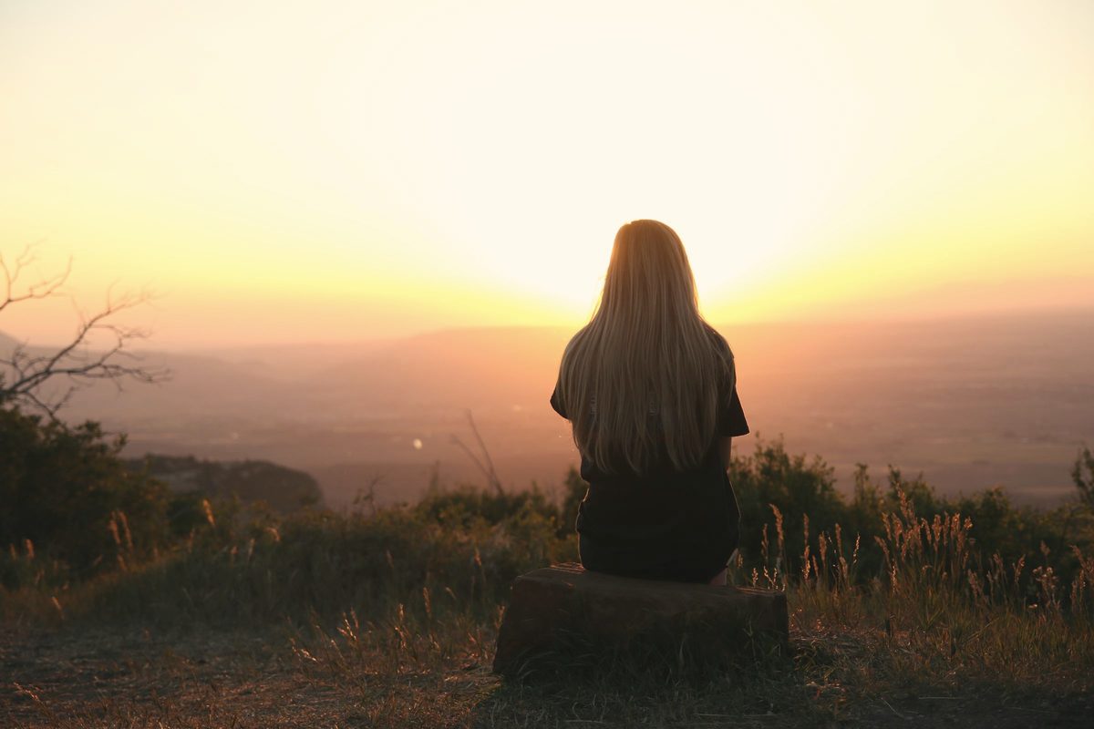 Woman looking at sunset
