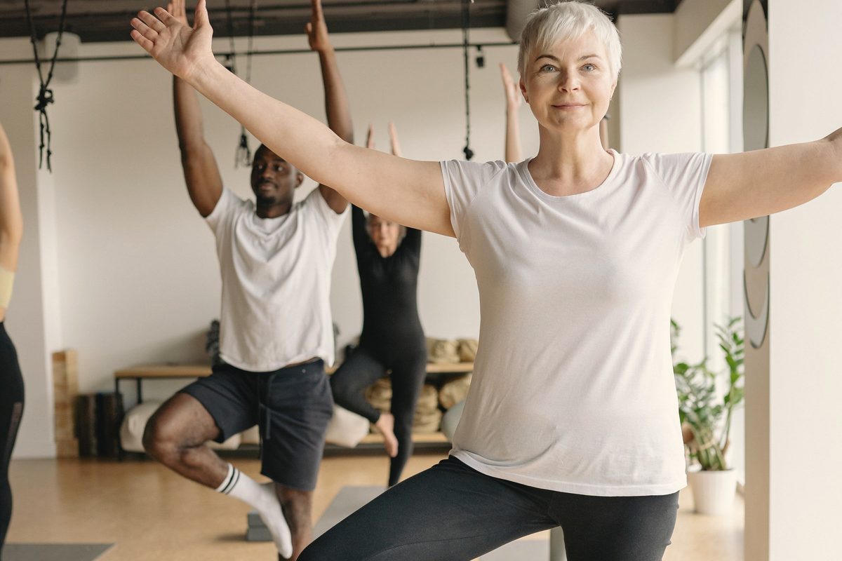 Older woman practising a slow balance pose