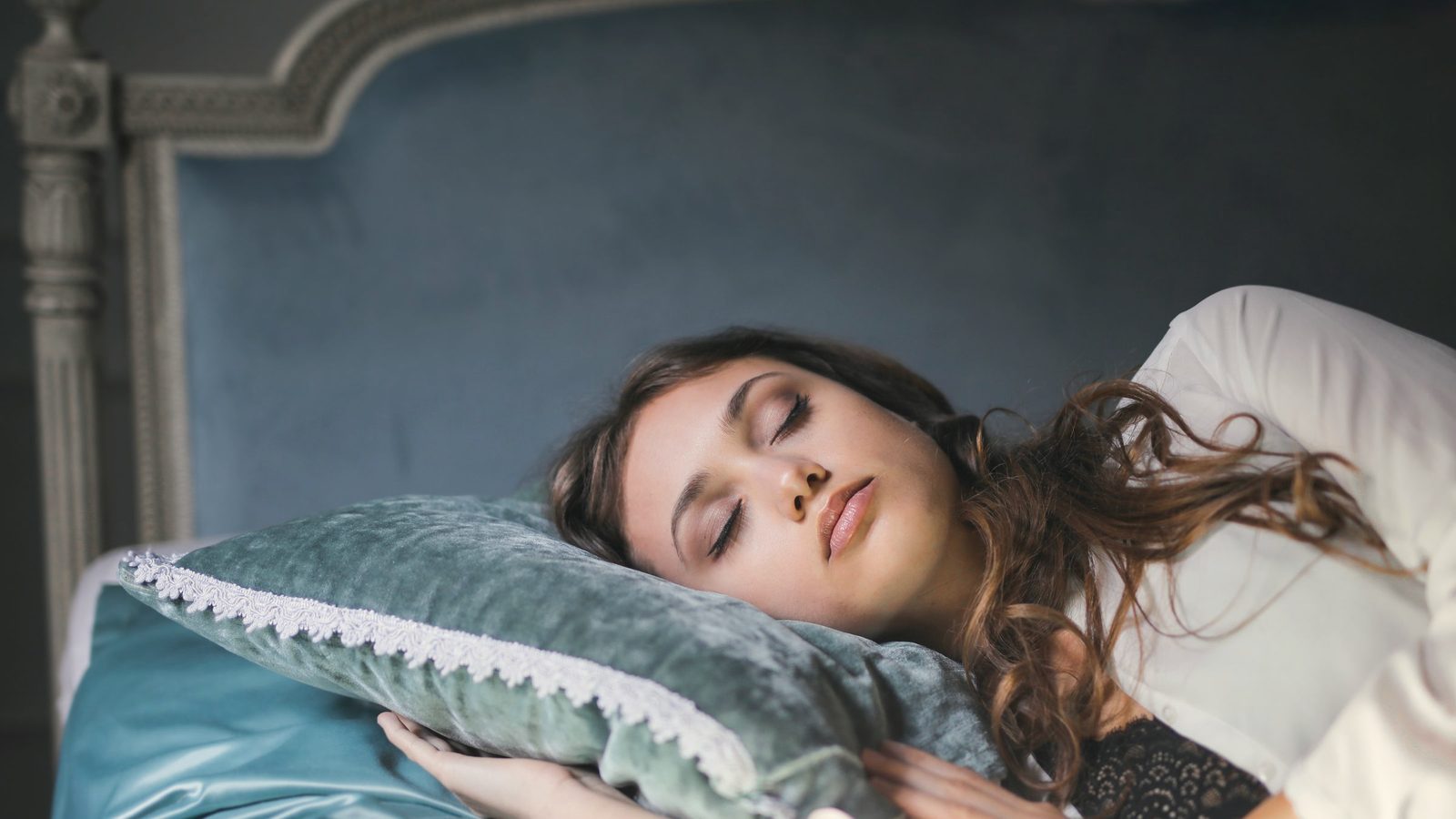 Woman sleeping peacefully in bed