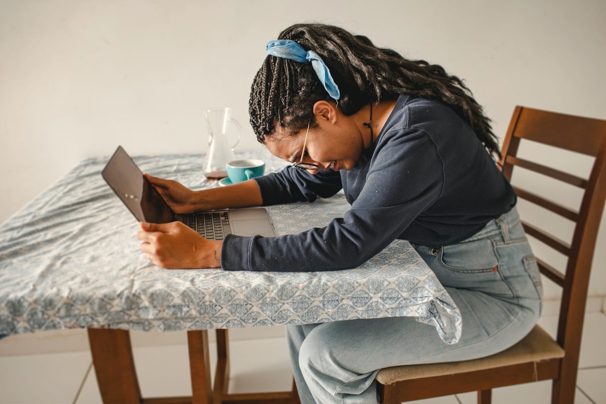 Stressed woman resting her head on the table