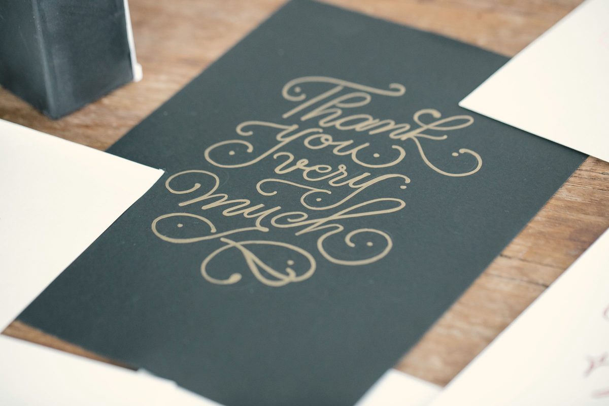 Thank you greeting card on wooden table