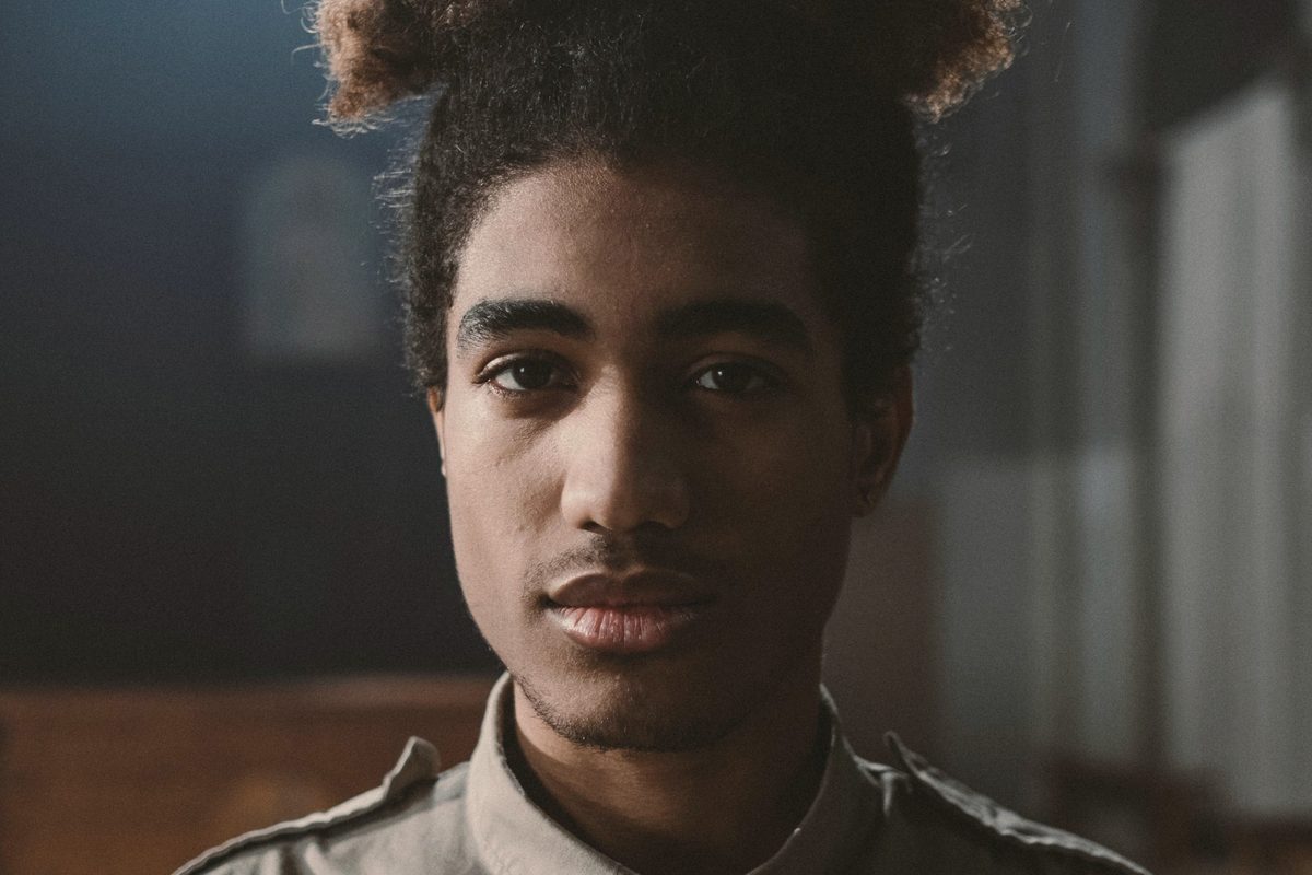 Young man waiting, looking thoughtful