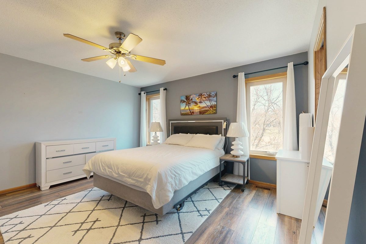 Bright, minimalist bedroom in morning light