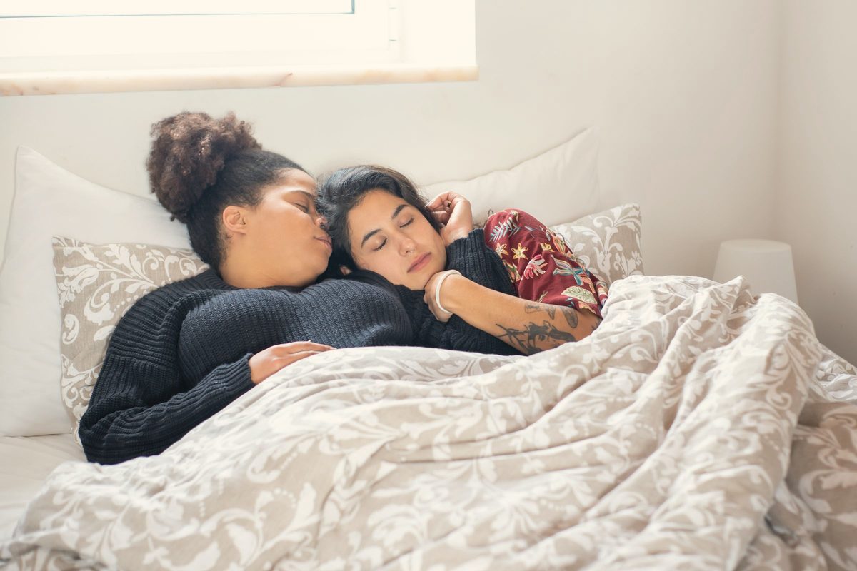 Couple sleeping in bed