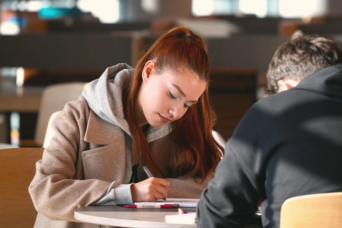 Students studying together in a modern library
