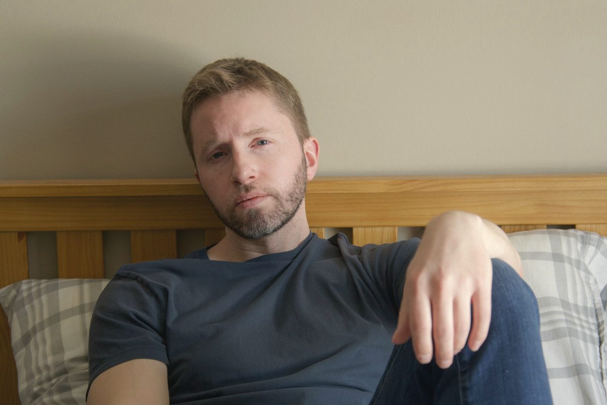 Man lying awake in bed
