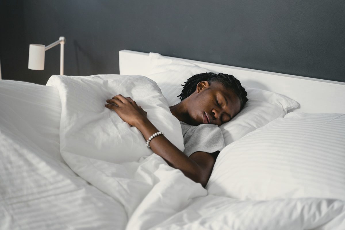 A man sleeping on the bed