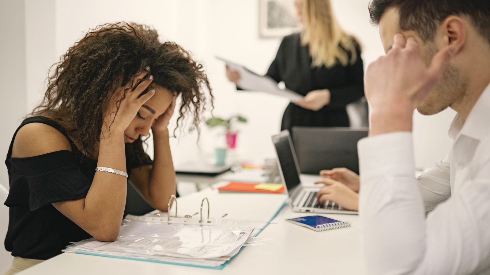 Stressed woman working at the office