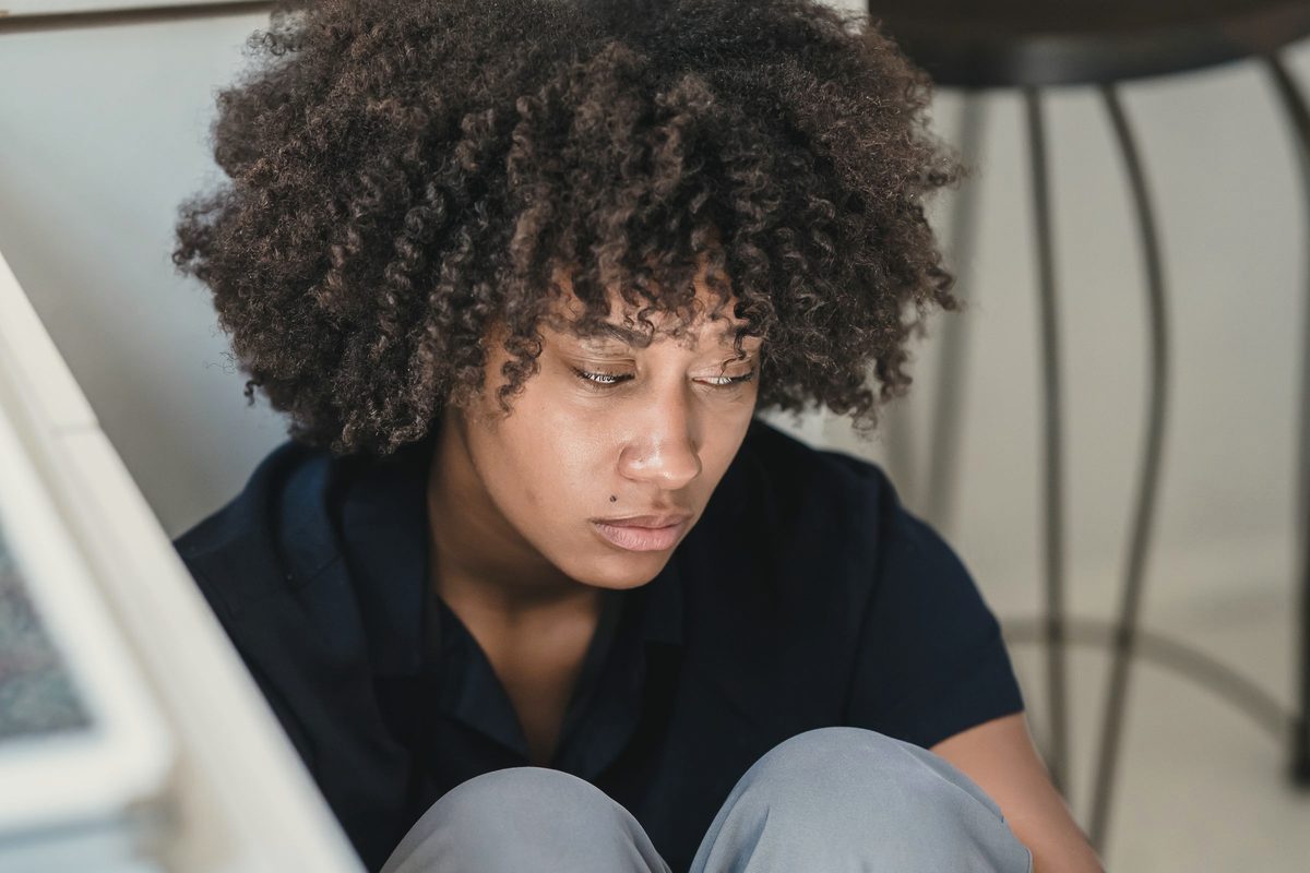 Stressed office worker sitting on the floor