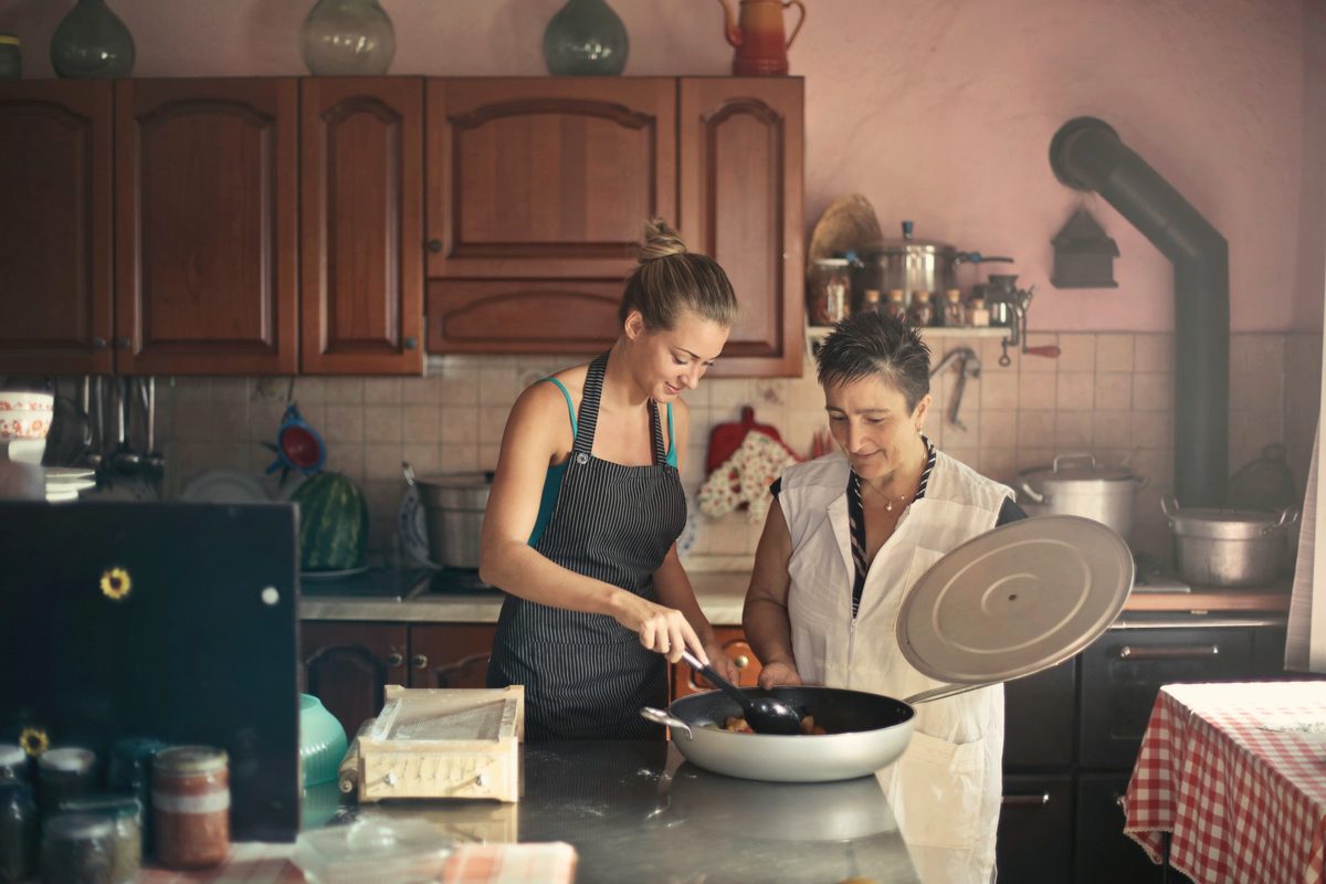 Friends cooking together in a home kitchen
