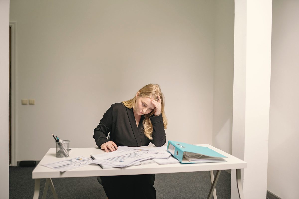 Stressed woman sitting at the table