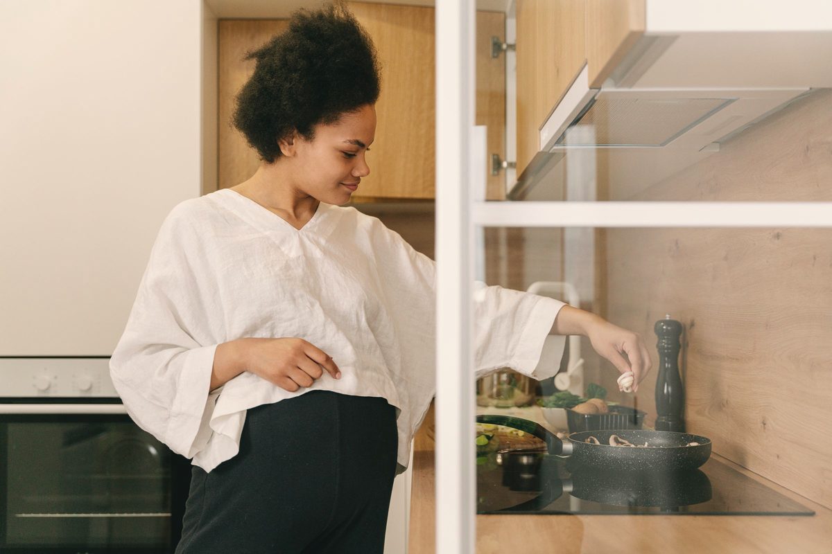 A woman cooking in the kitchen