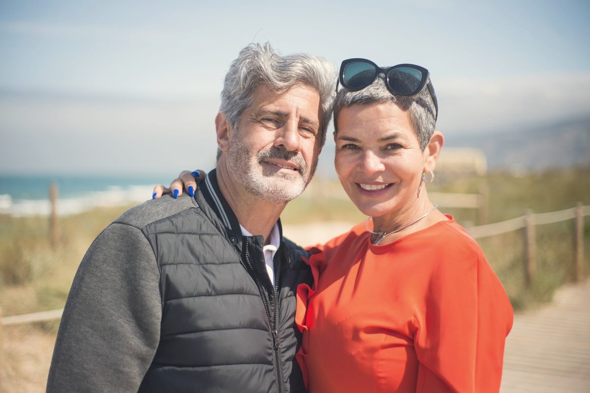 An elderly couple smiling
