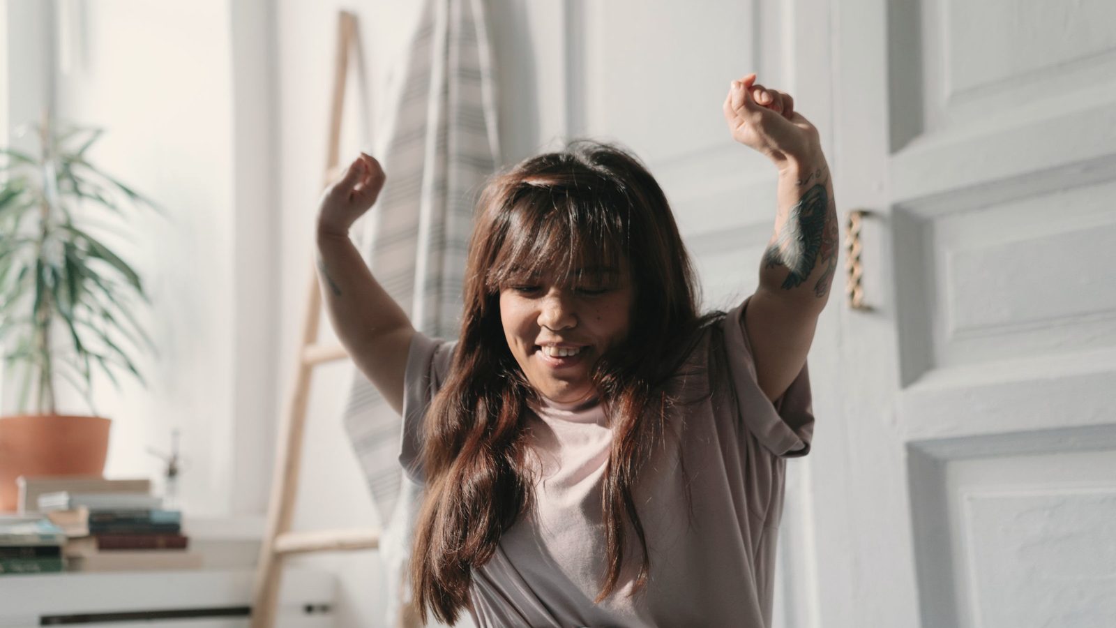Woman stretching as she wakes up in the morning