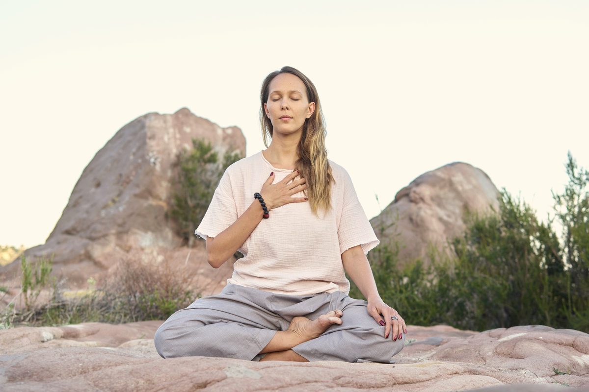 Woman meditating with her eyes closed