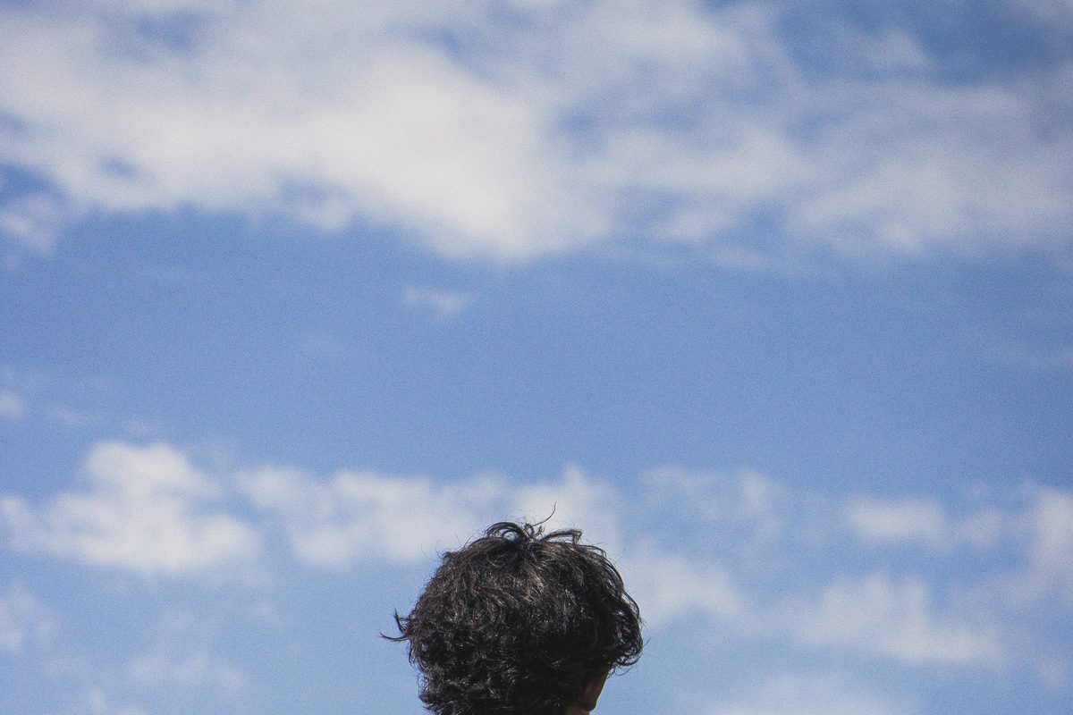 Man standing outdoors taking a quiet moment