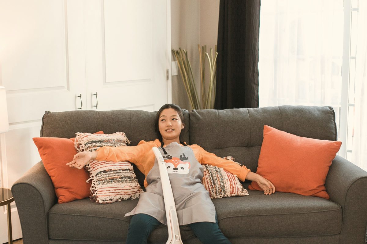 Tired woman resting on a couch