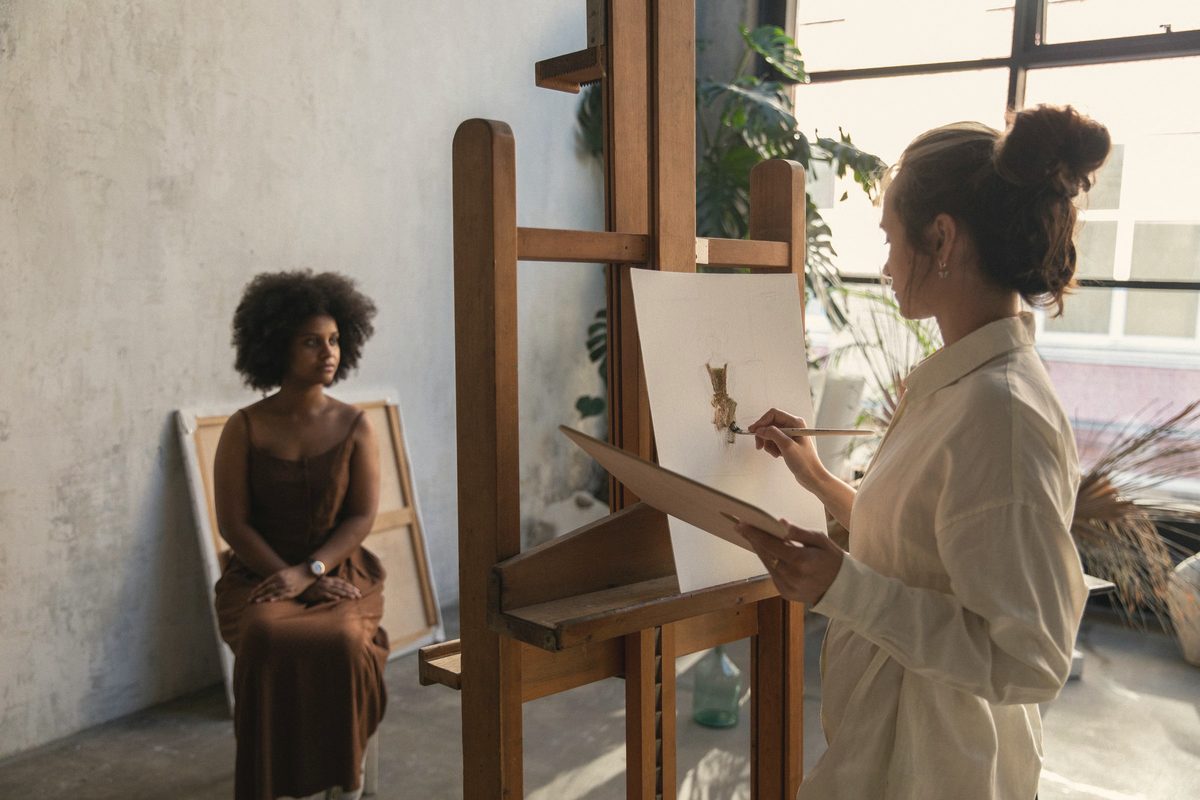 Artist painting at an easel