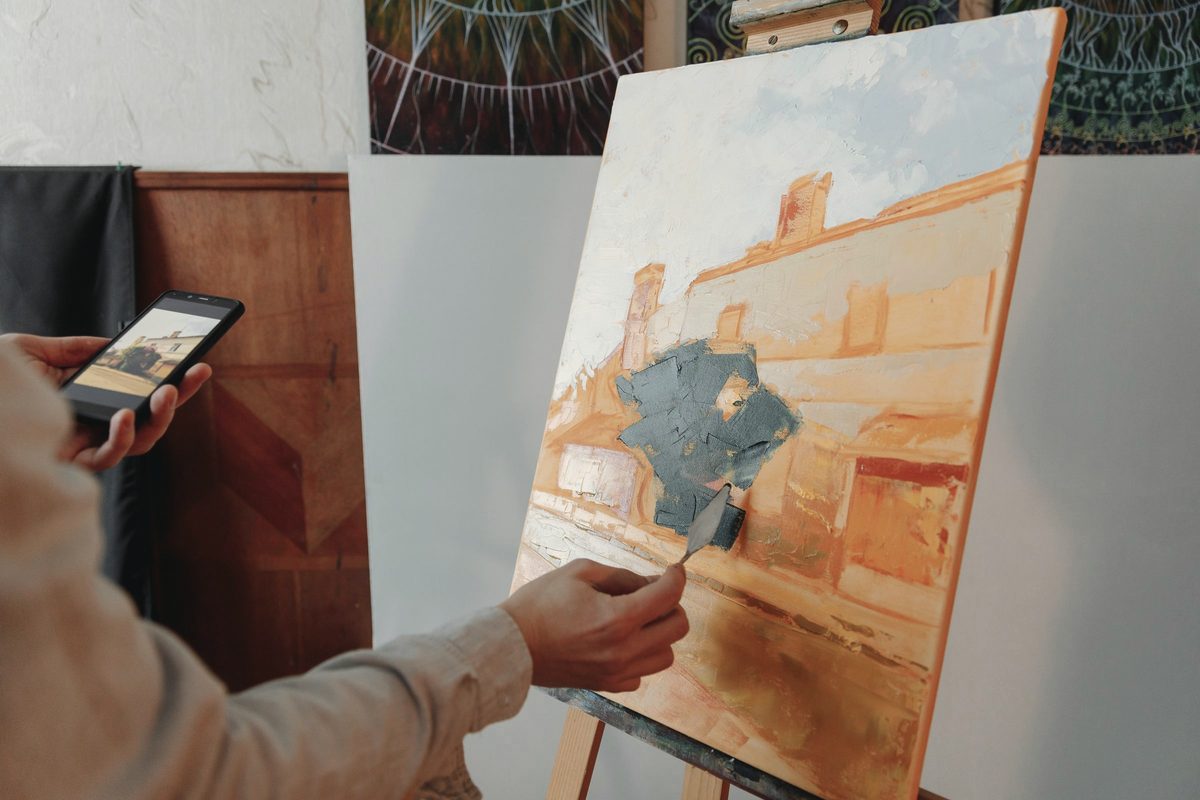 A person painting on a canvas