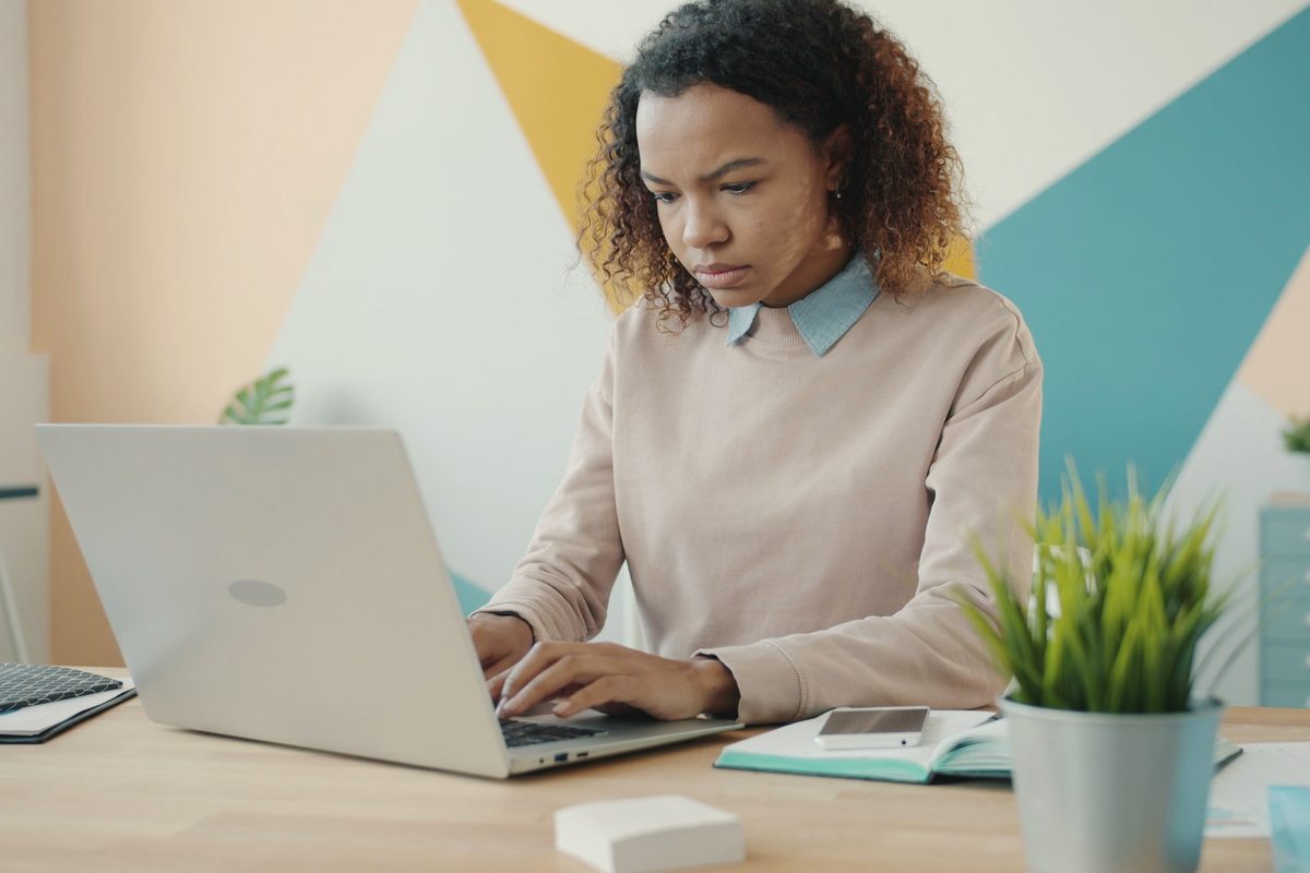 Woman concentrating on her work at a laptop