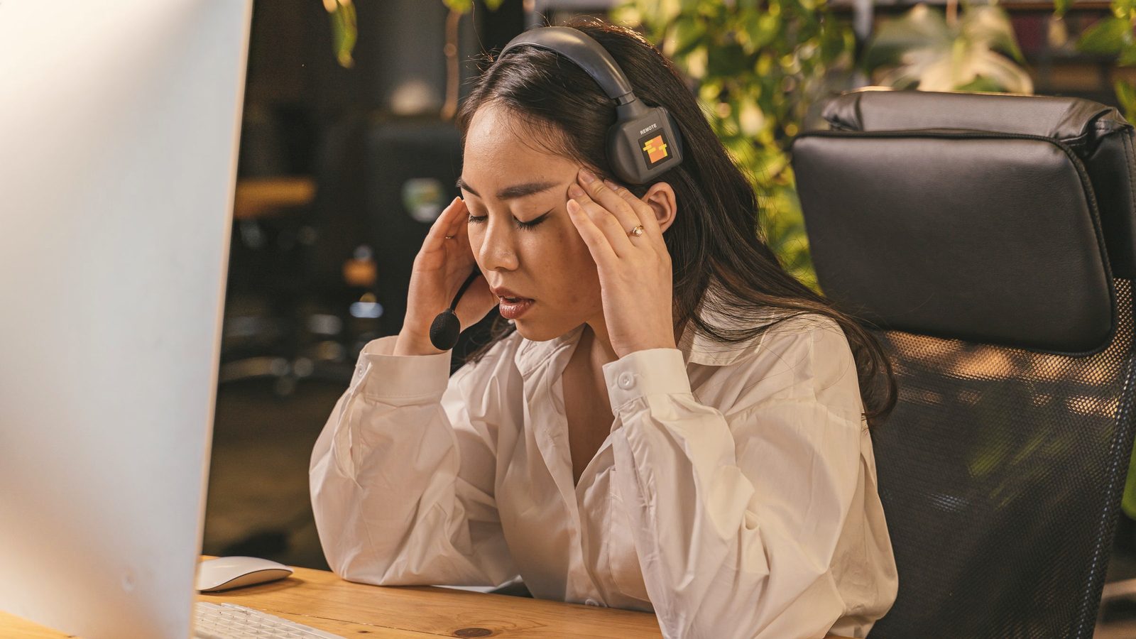 Tired woman at a desk in an office