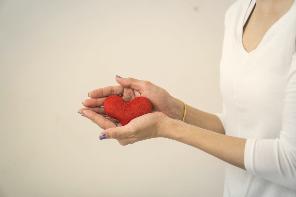 Hands holding a small heart shape
