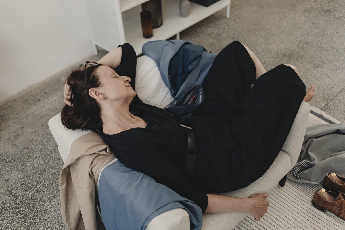 Tired woman sleeping on a sofa