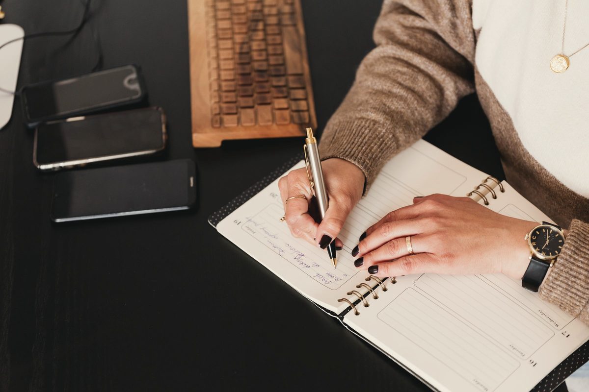 Woman writing in notebook