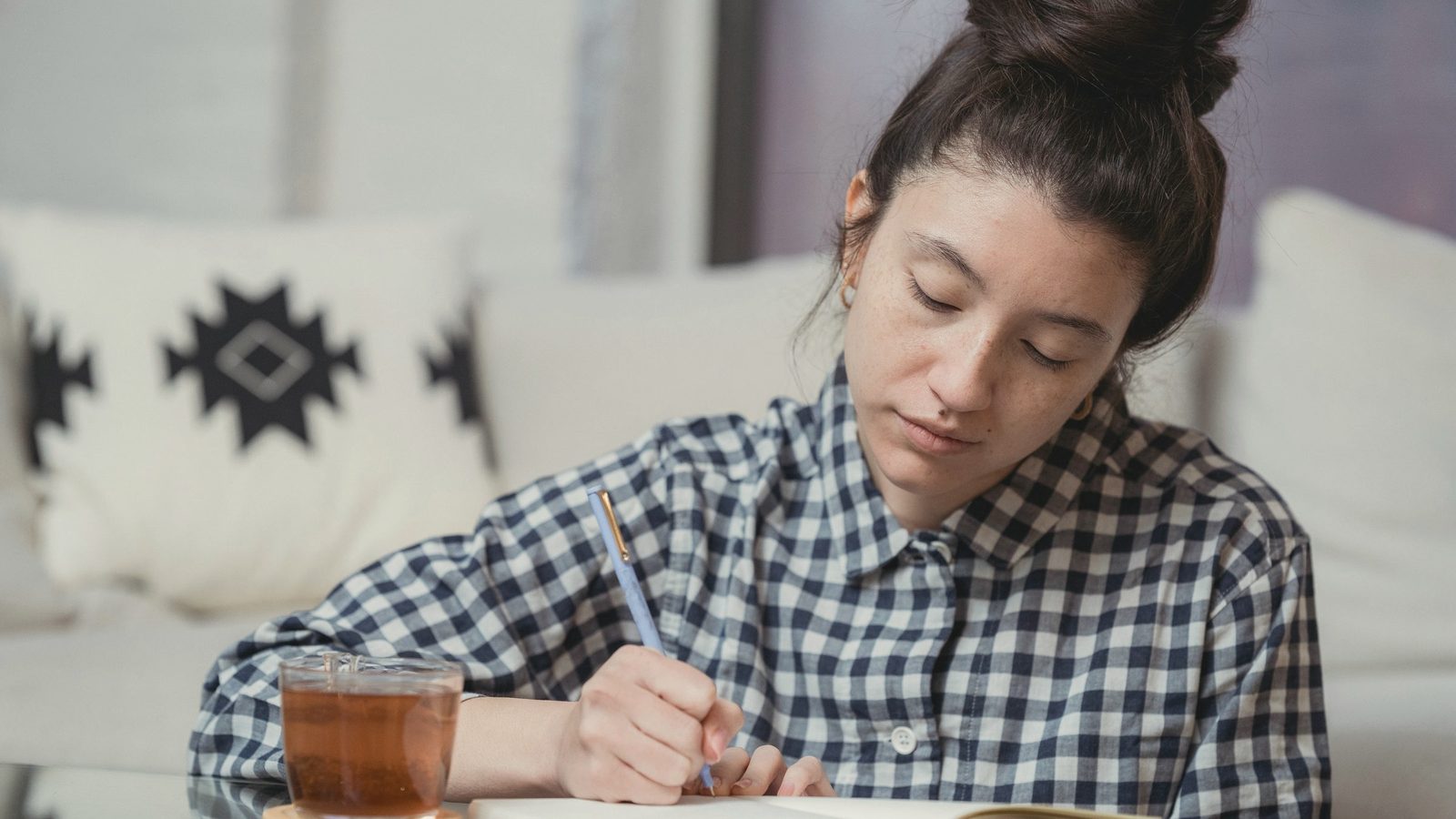 Woman taking notes in a notebook